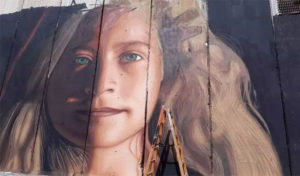 Palestine : Un portrait sur le mur de séparation à l’occasion de la libération d’Ahed Tamimi